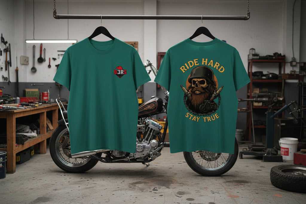 B3RS Ride Hard Stay True Skull T-Shirt displayed on a hanger in a garage with motorcycle in background.